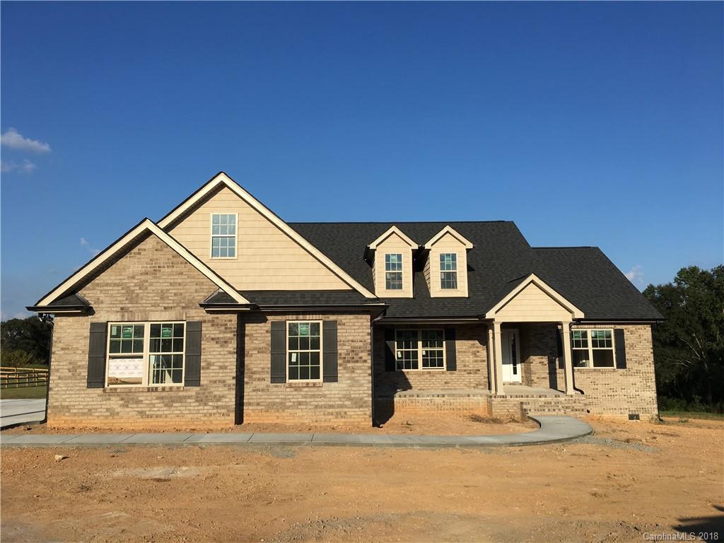 3115 East Brief Road, Unit 3 Monroe, NC 28110 - Photo 1 of 12 a front view of a house with a yard