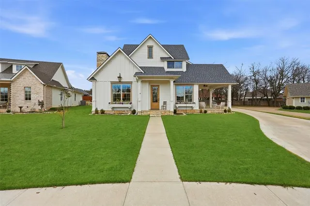 front view of a house with a yard