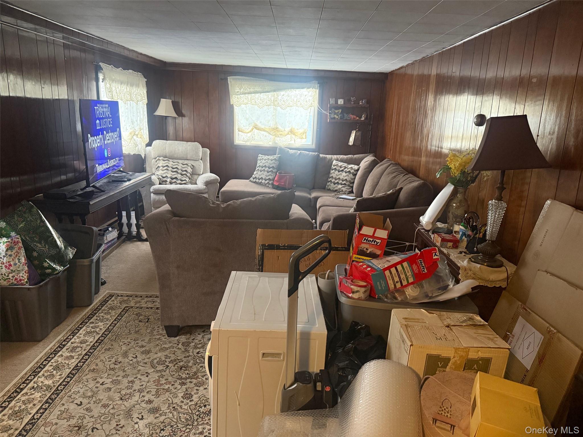 8 Beech Place Lake Peekskill, NY 10537 - Photo 18 of 19 a living room with furniture a window and a flat screen tv
