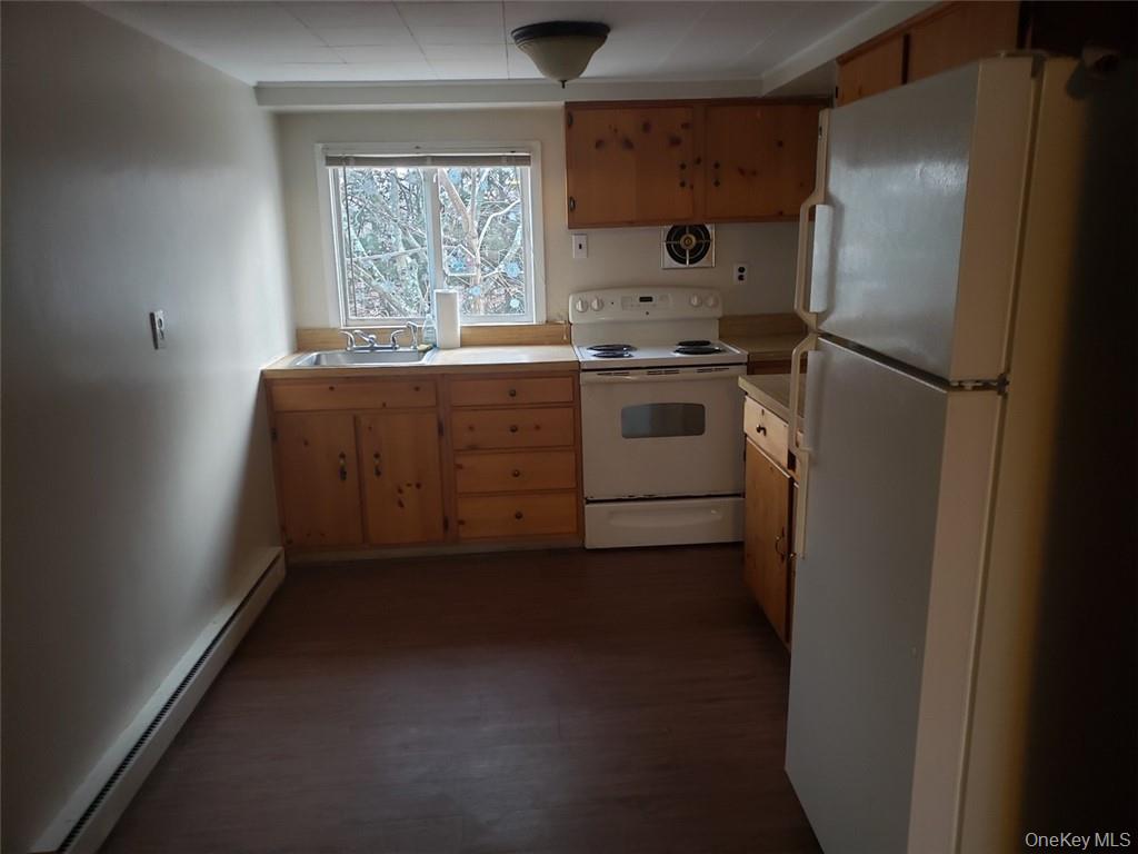 8 Beech Place Lake Peekskill, NY 10537 - Photo 3 of 19 a kitchen with a refrigerator and window