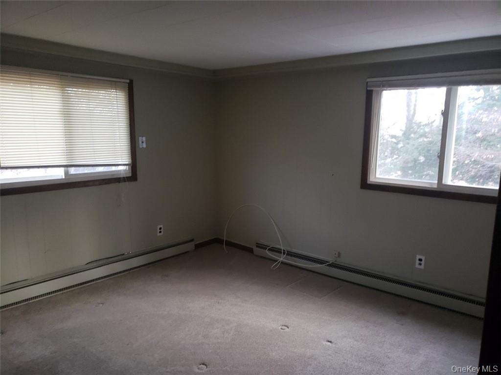 8 Beech Place Lake Peekskill, NY 10537 - Photo 5 of 19 an empty room with a window