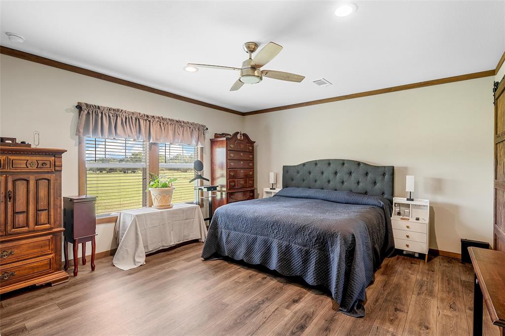 152 County Road 152 Riesel, TX 76682 - Photo 13 of 27 a bedroom with a bed and a large window