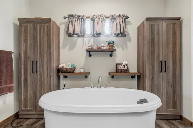 a bathroom with a sink a toilet and shower curtain