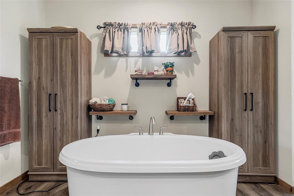 152 County Road 152 Riesel, TX 76682 - Photo 15 of 27 a bathroom with a sink a toilet and shower curtain