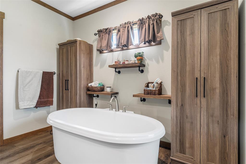 152 County Road 152 Riesel, TX 76682 - Photo 16 of 27 a bathroom with a sink a toilet and shower