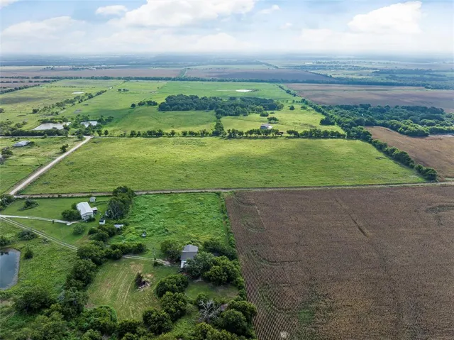 a view of a field with an ocean