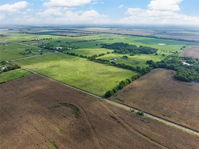 a view of a field with an ocean