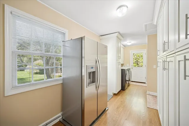 a view of a kitchen with a refrigerator a sink and dishwasher