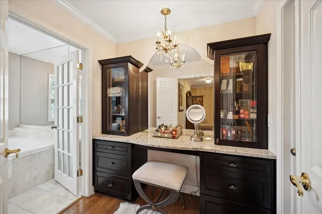 a bathroom with a sink vanity granite and a mirror