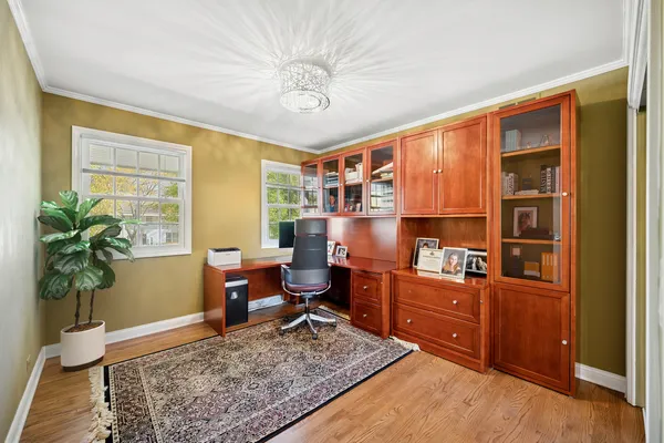 a work room with furniture and wooden floor