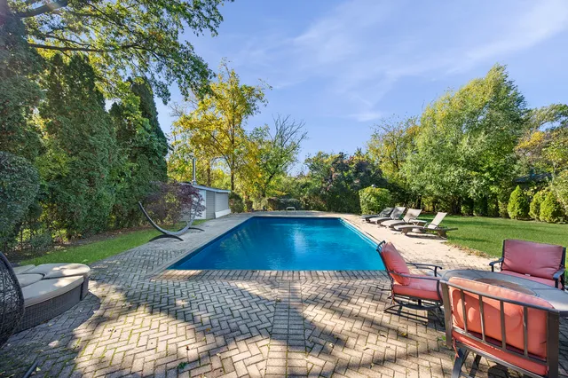 a view of swimming pool with lounge chair