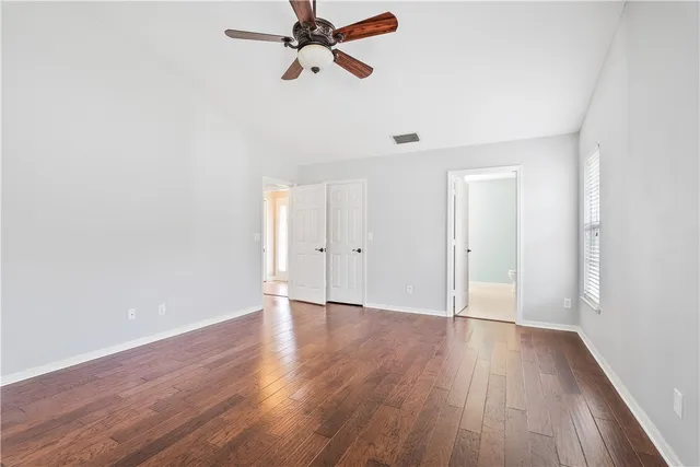 a view of a room with wooden floor