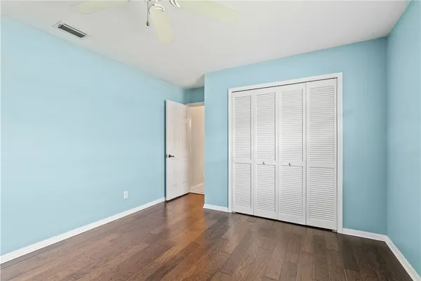 an empty room with wooden floor