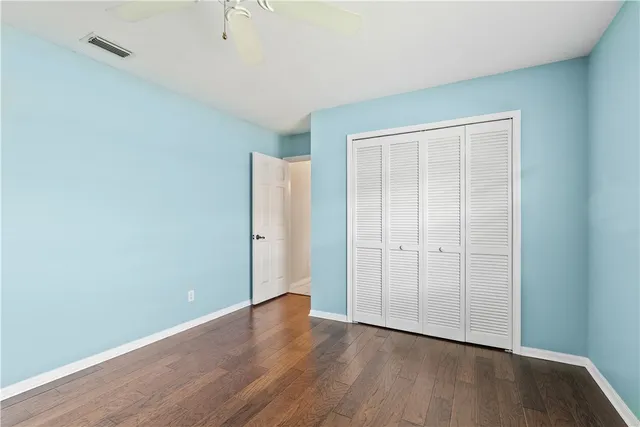 an empty room with wooden floor