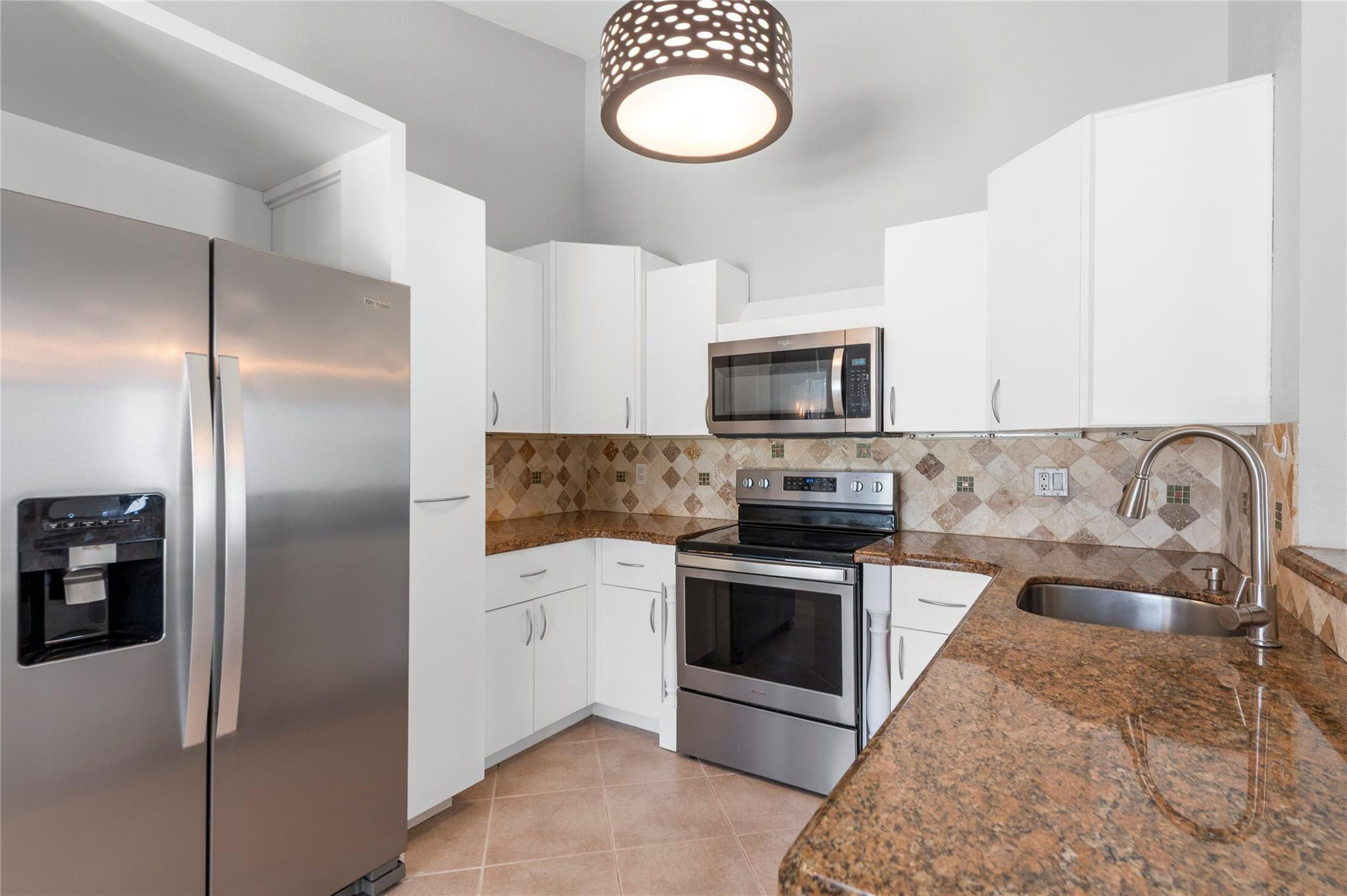 22840 Markham Way Boca Raton, FL 33428 - Photo 1 of 30 a kitchen with a refrigerator sink and stove