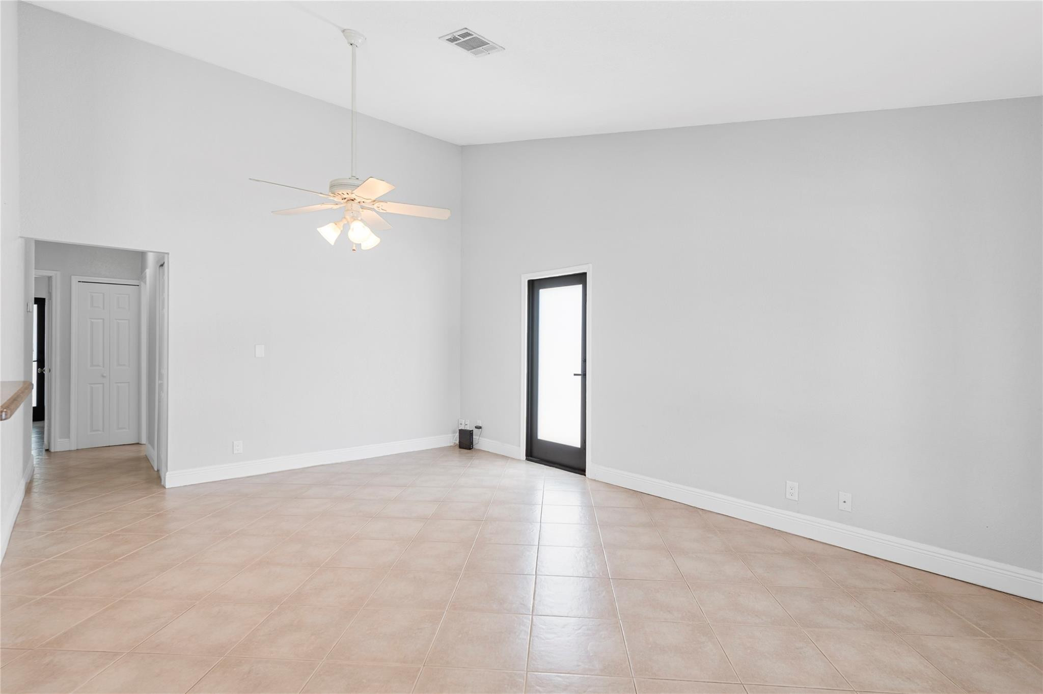 22840 Markham Way Boca Raton, FL 33428 - Photo 11 of 30 an empty room with chandelier fan