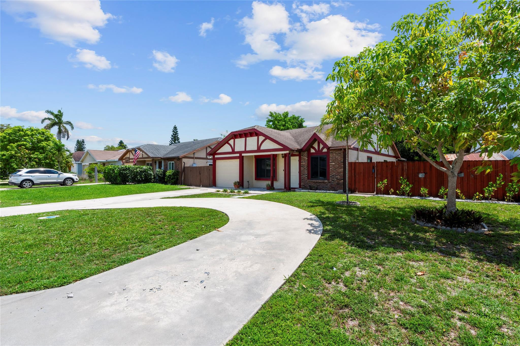 22840 Markham Way Boca Raton, FL 33428 - Photo 20 of 30 a front view of a house with yard and green space