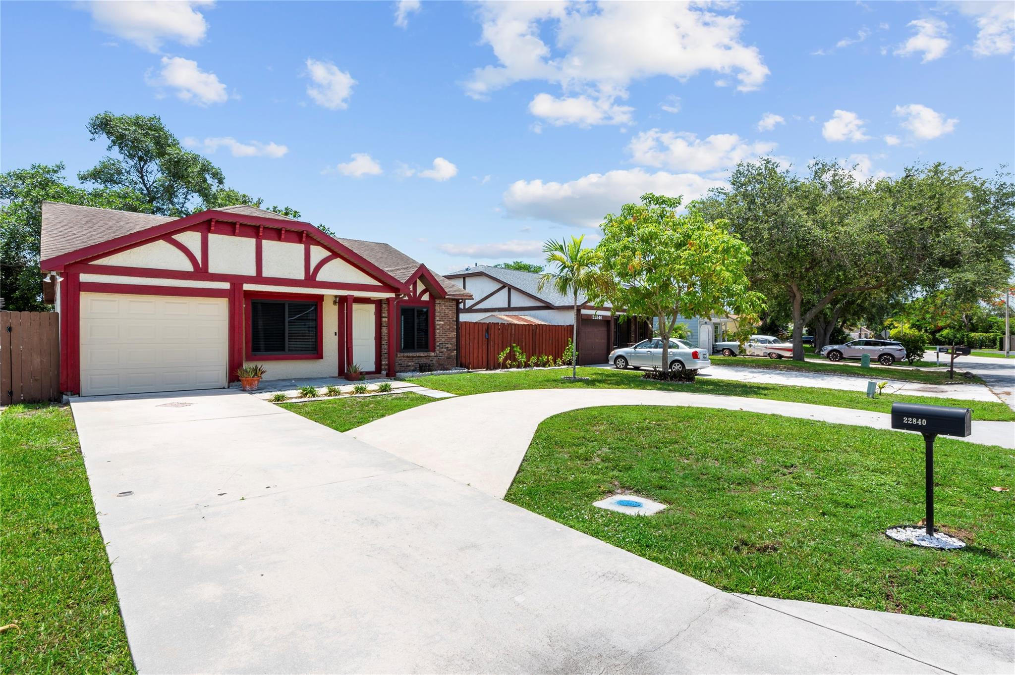 22840 Markham Way Boca Raton, FL 33428 - Photo 22 of 30 a front view of a house with garden