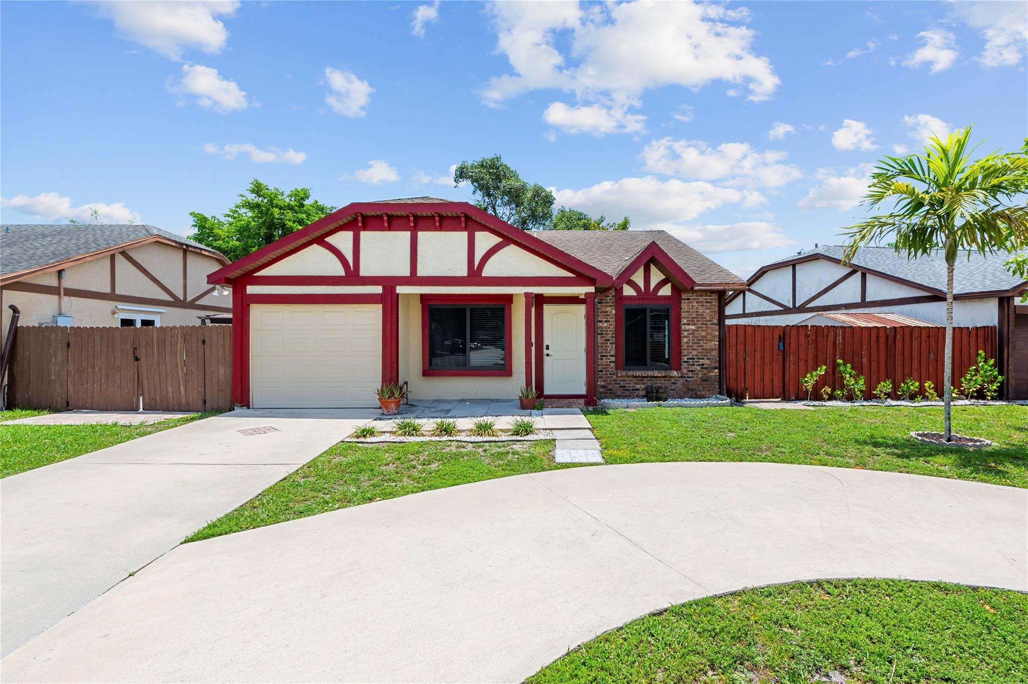 22840 Markham Way Boca Raton, FL 33428 - Photo 23 of 30 a front view of a house with a garden and entryway