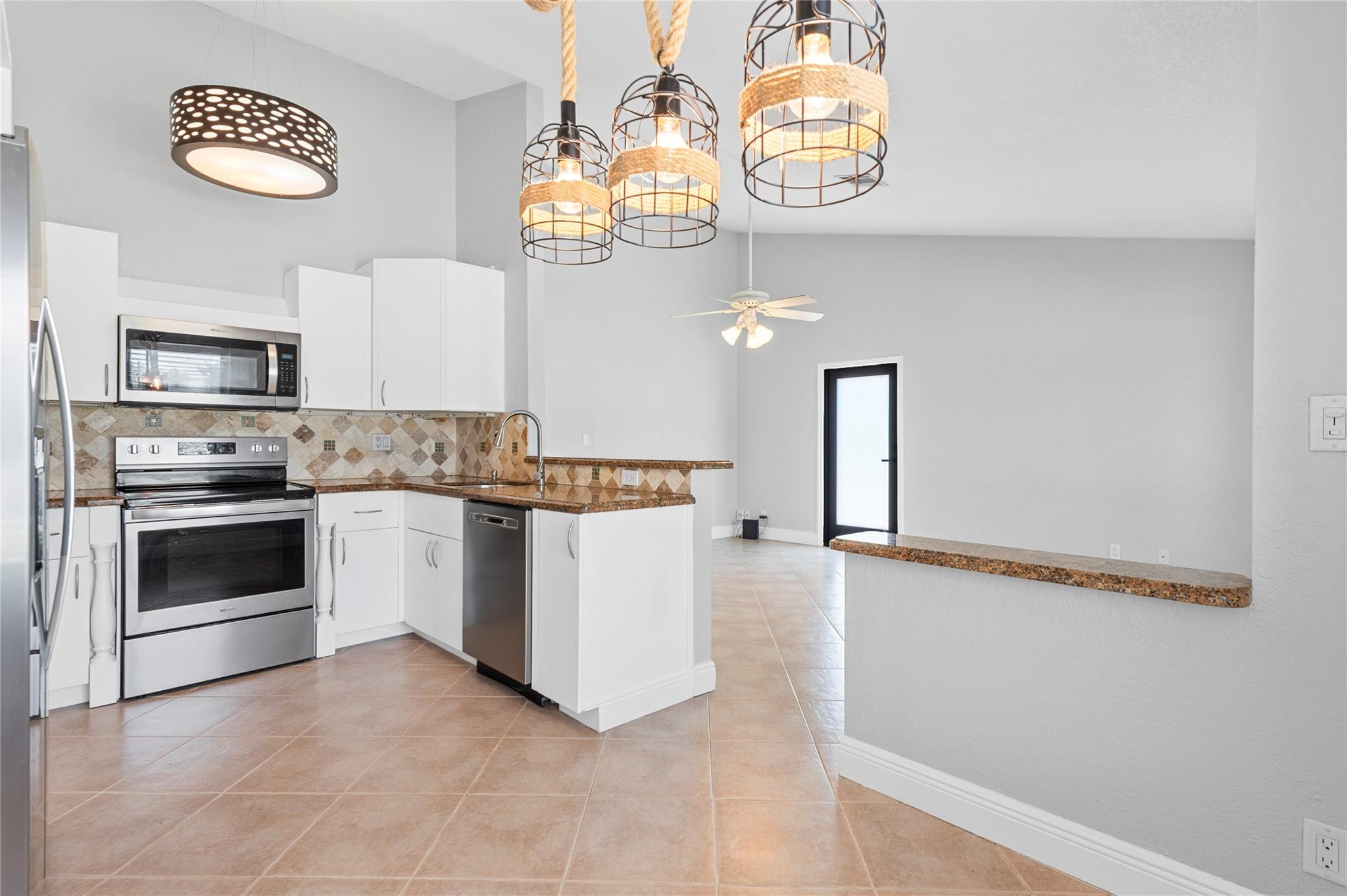 22840 Markham Way Boca Raton, FL 33428 - Photo 3 of 30 a kitchen with a stove oven and a sink