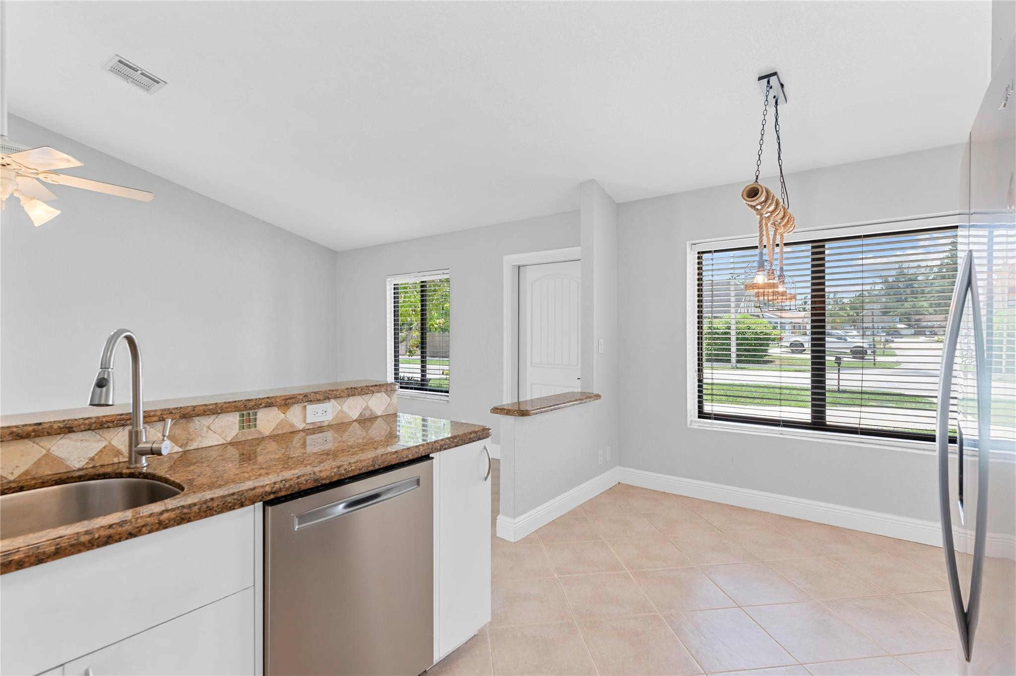22840 Markham Way Boca Raton, FL 33428 - Photo 4 of 30 a kitchen with a sink and a window