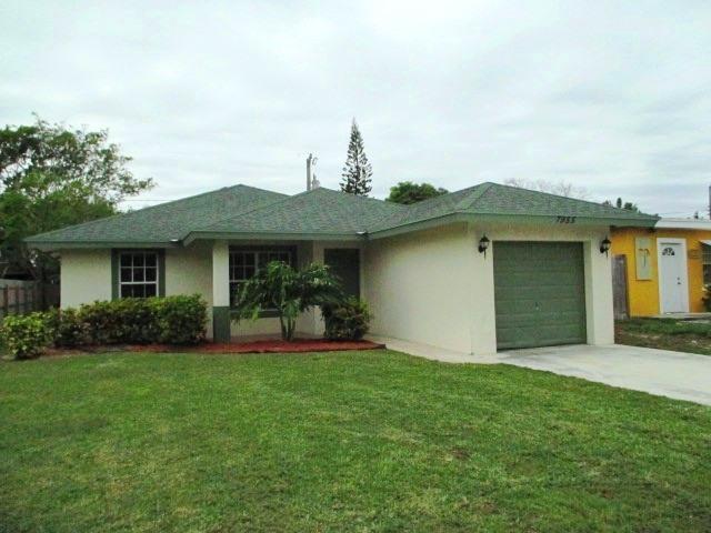 7955 Terrace Road Hypoluxo, FL 33462 - Photo 1 of 14 Front