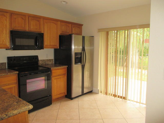 7955 Terrace Road Hypoluxo, FL 33462 - Photo 8 of 14 Kitchen View2