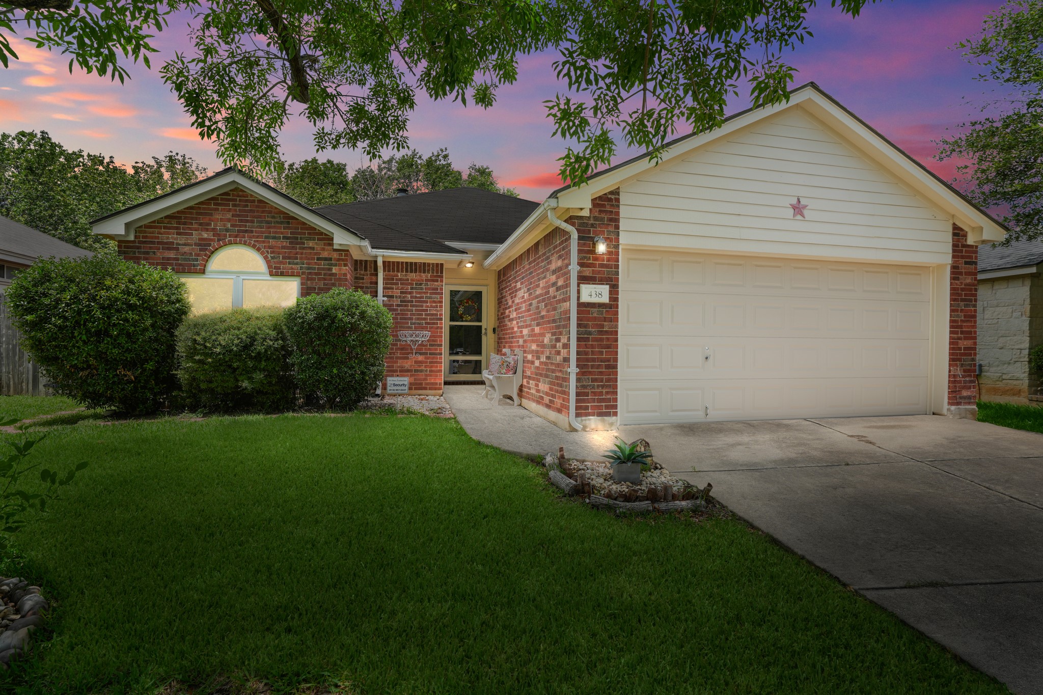 438 Katy Crossing Georgetown, TX 78626 - Photo 24 of 24 A classic brick exterior offers enduring appeal with a well-maintained lawn and convenient attached garage.