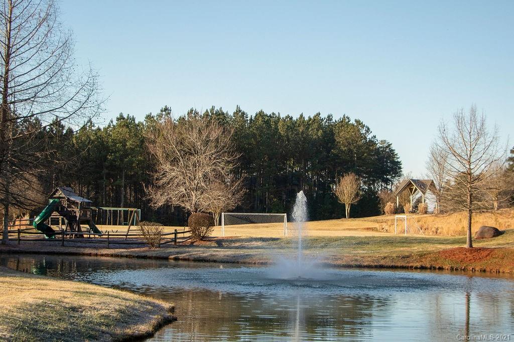 1105 Reflection Pointe Boulevard, Unit 13 Belmont, NC 28012 - Photo 13 of 25 a view of lake with trees