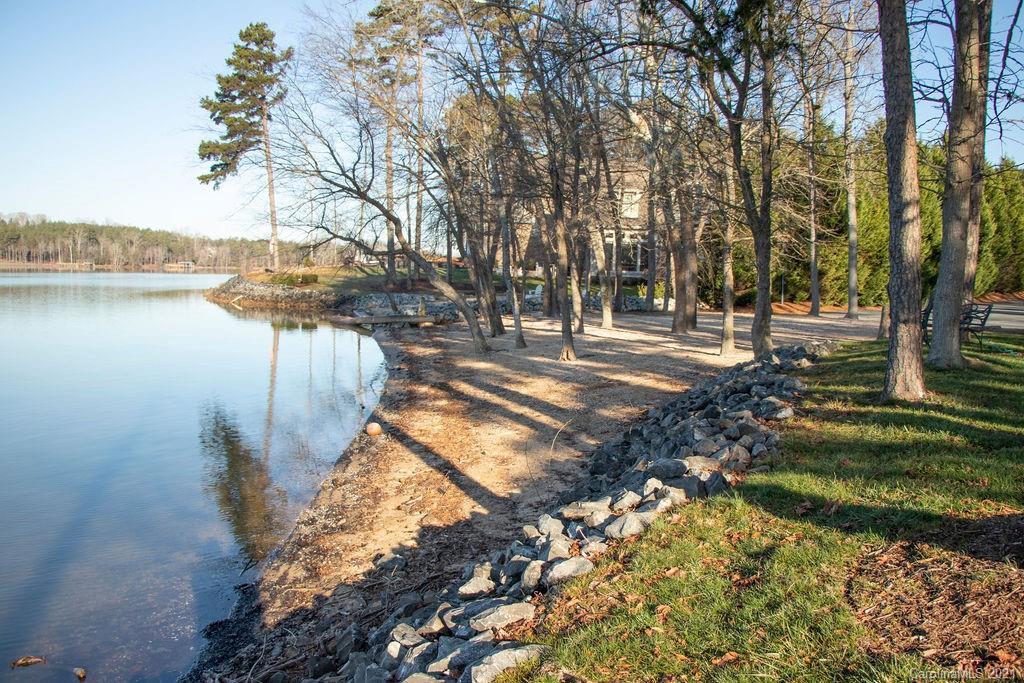 1105 Reflection Pointe Boulevard, Unit 13 Belmont, NC 28012 - Photo 17 of 25 a view of a yard with plants and large trees