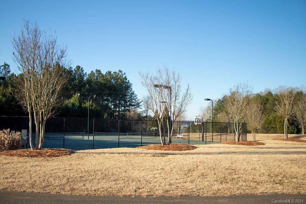 1105 Reflection Pointe Boulevard, Unit 13 Belmont, NC 28012 - Photo 21 of 25 a view of a yard with large trees