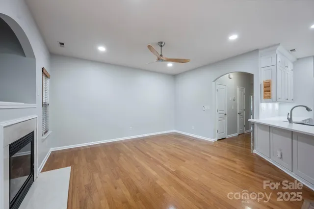 a view of a kitchen with a sink and a fireplace