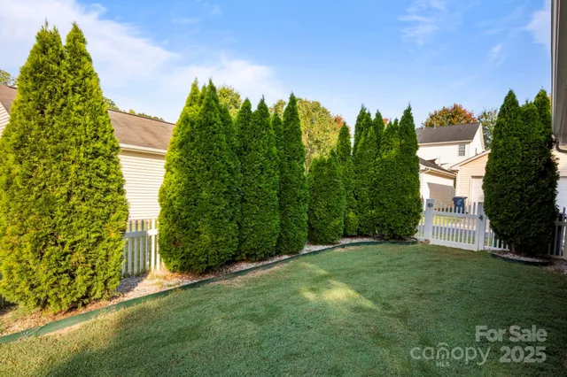 a backyard of a house with lots of green space