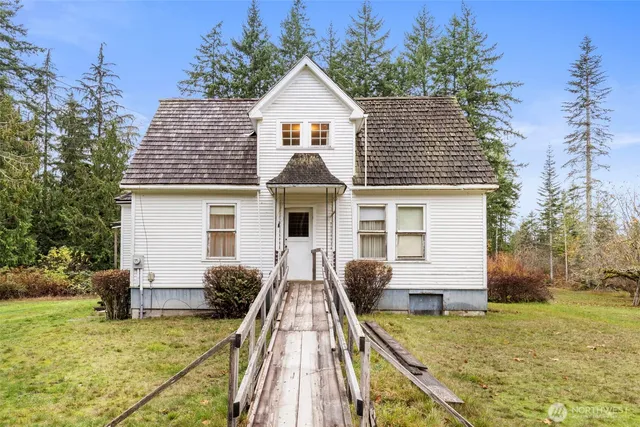 a front view of house with yard outdoor seating and barbeque oven