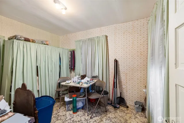 a view of a livingroom with furniture and window