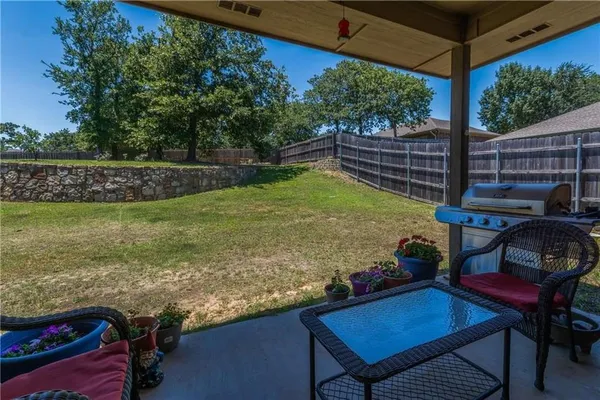 a view of a backyard with sitting area