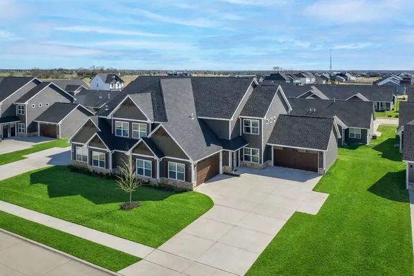 a view of a house with a backyard