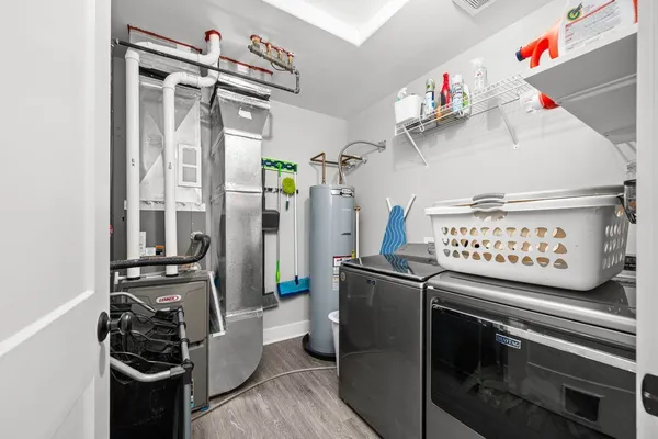 a kitchen with stainless steel appliances granite countertop a stove and cabinets