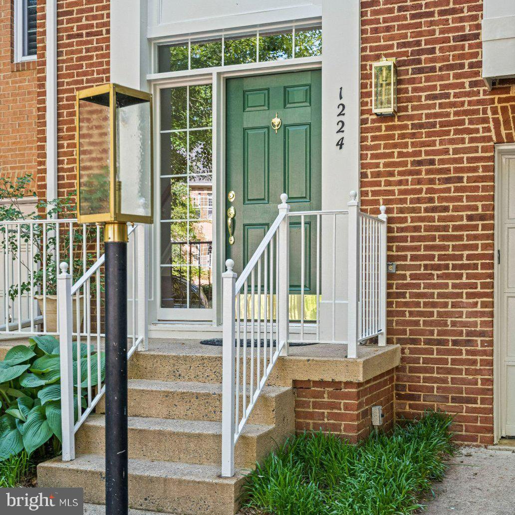 Charming entryway with green door.