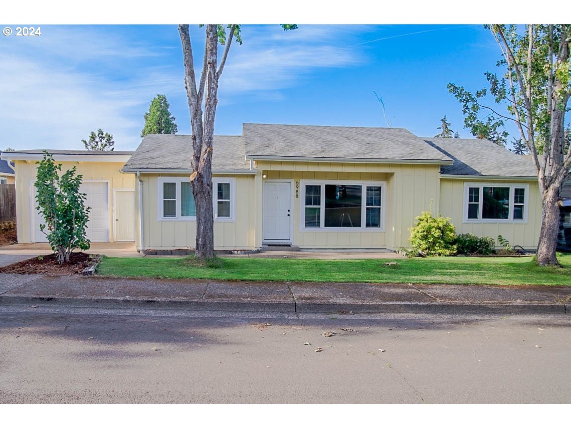 6988 Bluebelle Way Springfield, OR 97478 - Photo 1 of 28 a house view with a backyard space
