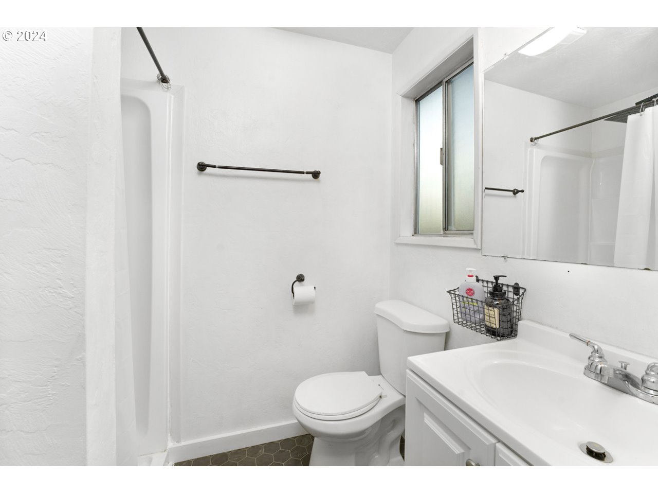 6988 Bluebelle Way Springfield, OR 97478 - Photo 15 of 28 a bathroom with a sink toilet and shower