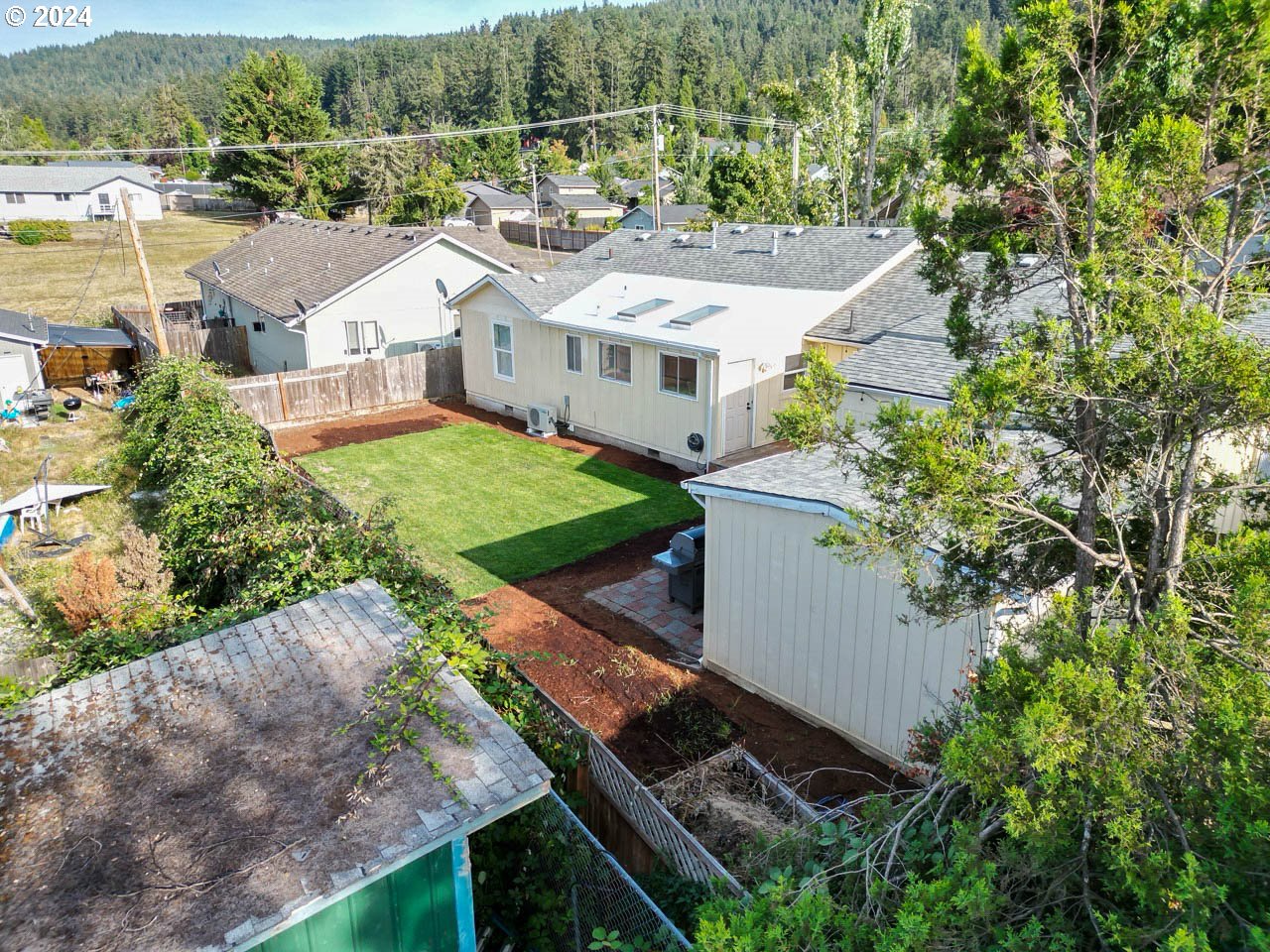 6988 Bluebelle Way Springfield, OR 97478 - Photo 23 of 28 an aerial view of a house with a yard