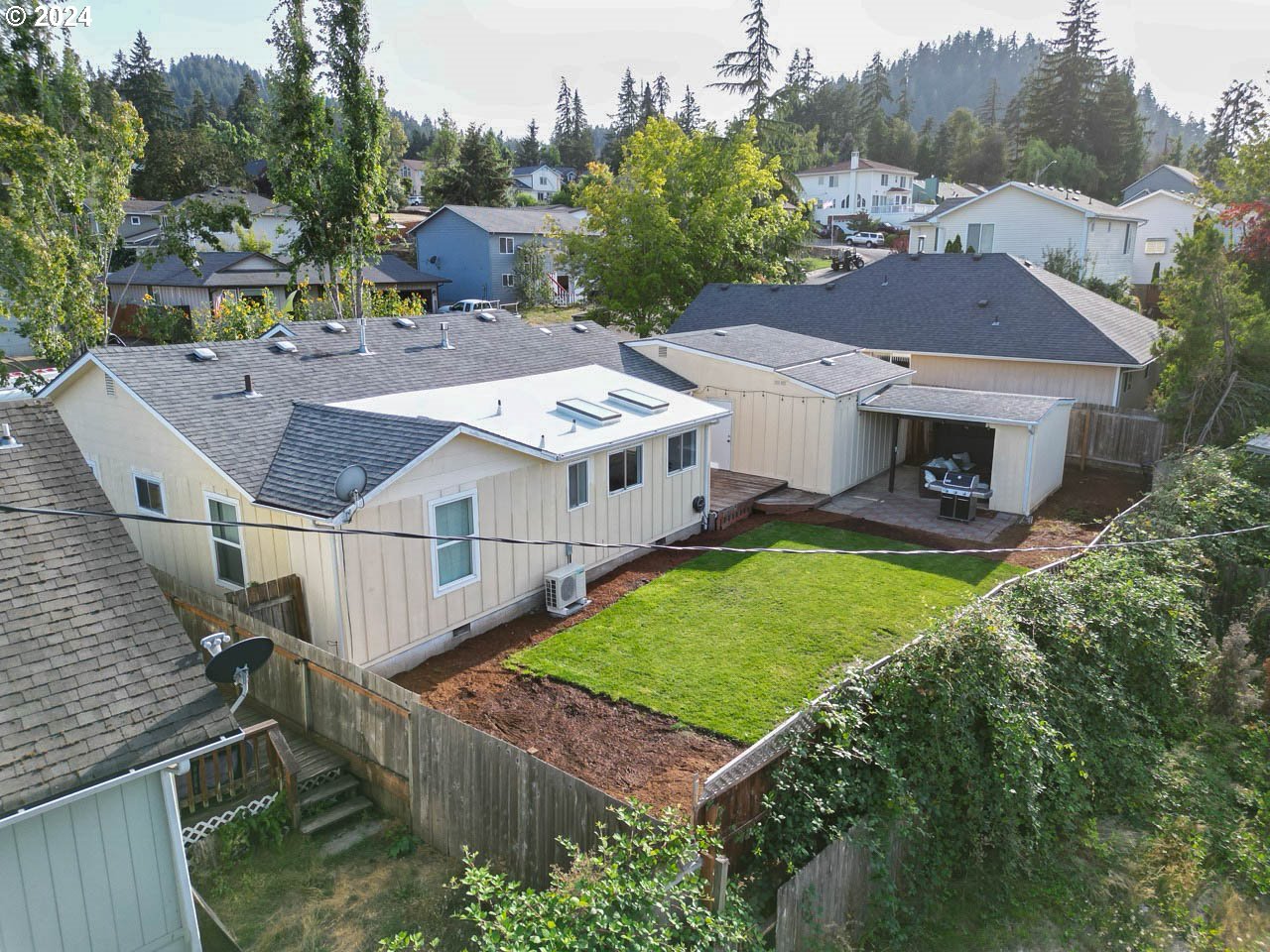 6988 Bluebelle Way Springfield, OR 97478 - Photo 24 of 28 a aerial view of a house with a yard