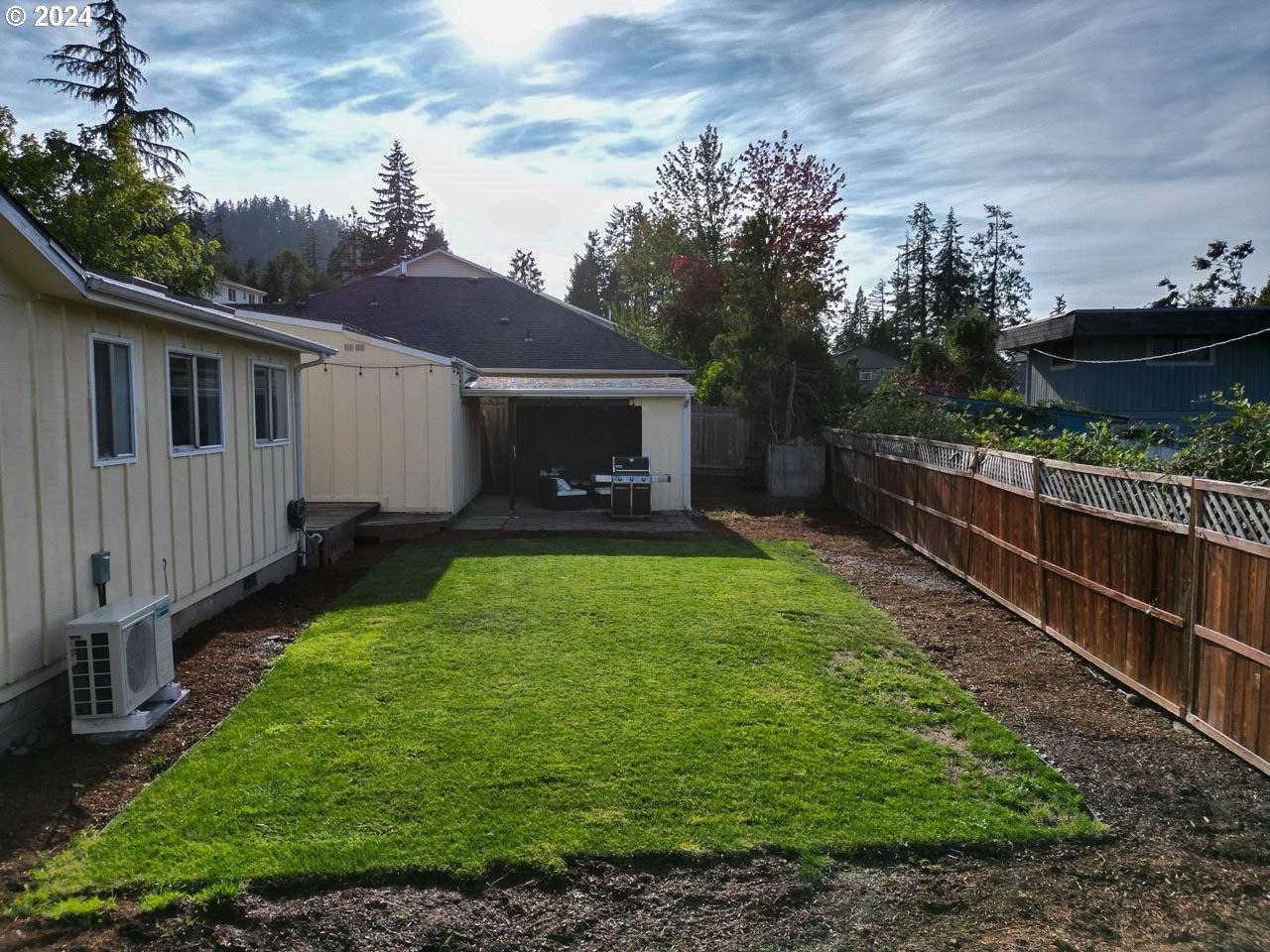6988 Bluebelle Way Springfield, OR 97478 - Photo 26 of 28 a view of a house with backyard and porch