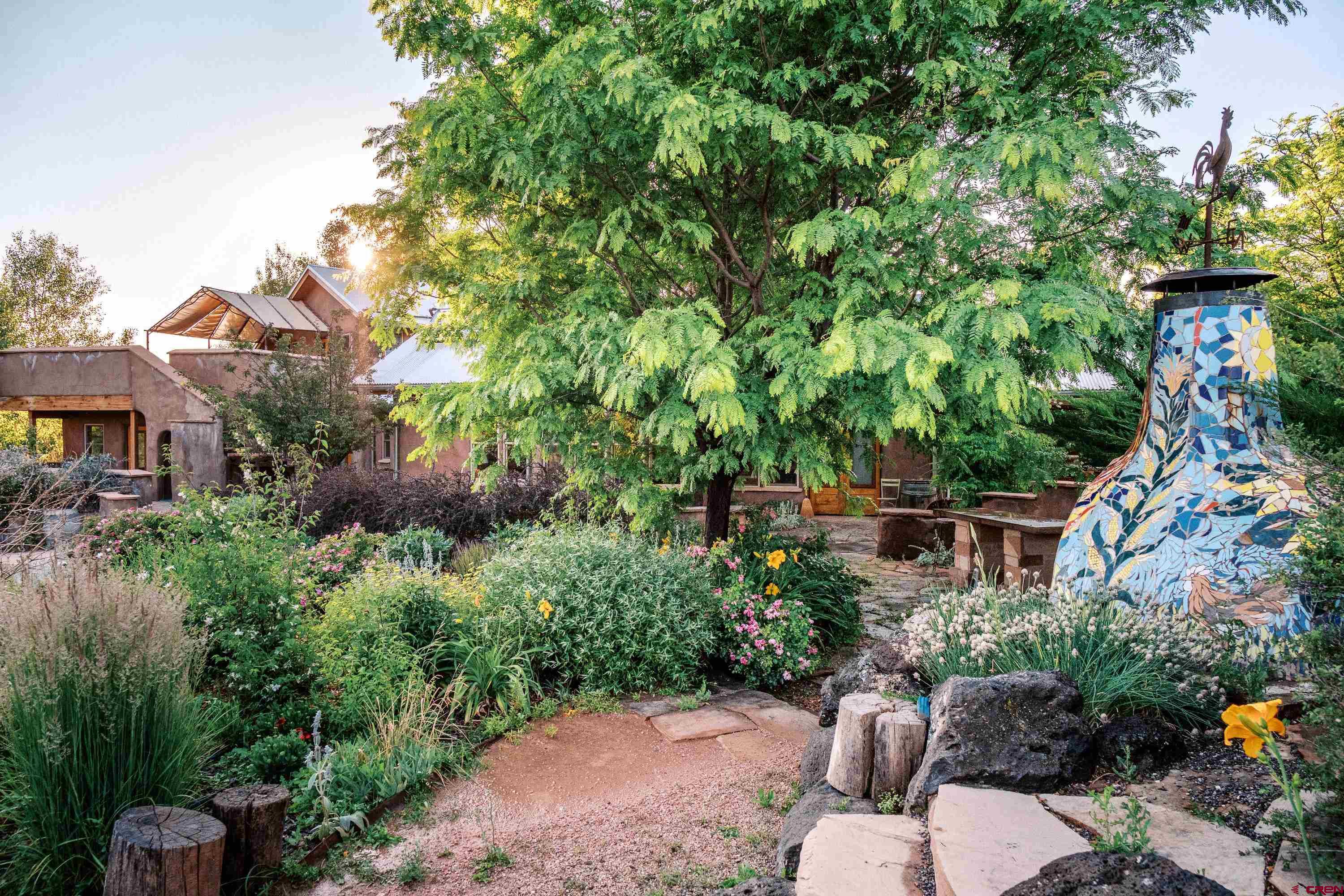 41723 O Road Paonia, CO 81428 - Photo 38 of 44 a view of a garden with plants and large trees