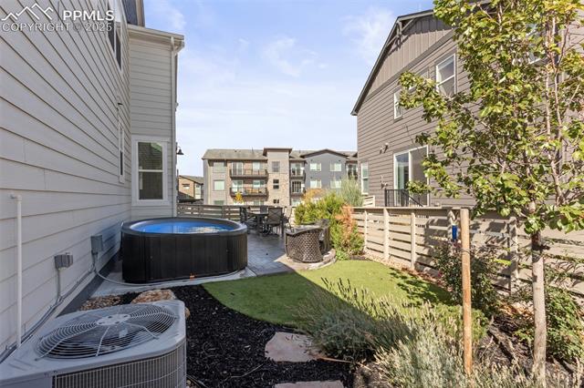 8258 Mount Ouray Road Littleton, CO 80125 - Photo 27 of 28 View of yard with central AC and a patio area