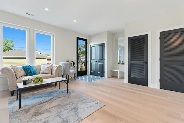 a living room with furniture and a table