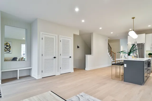 a view of a living room and kitchen