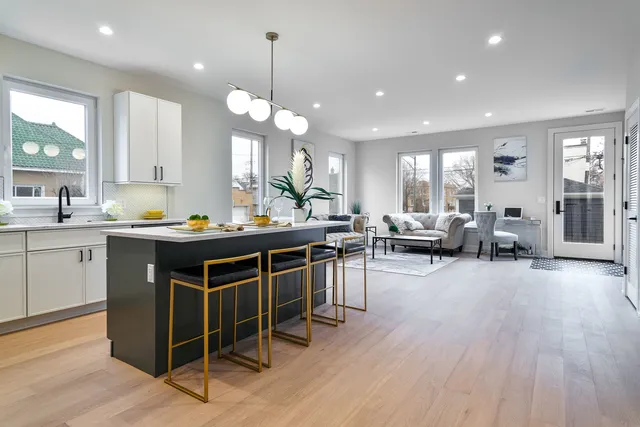 a kitchen with a table and chairs