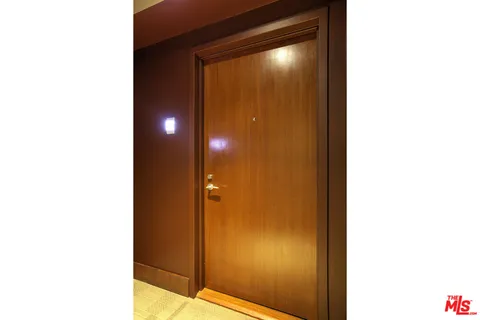 a view of hallway with bathroom